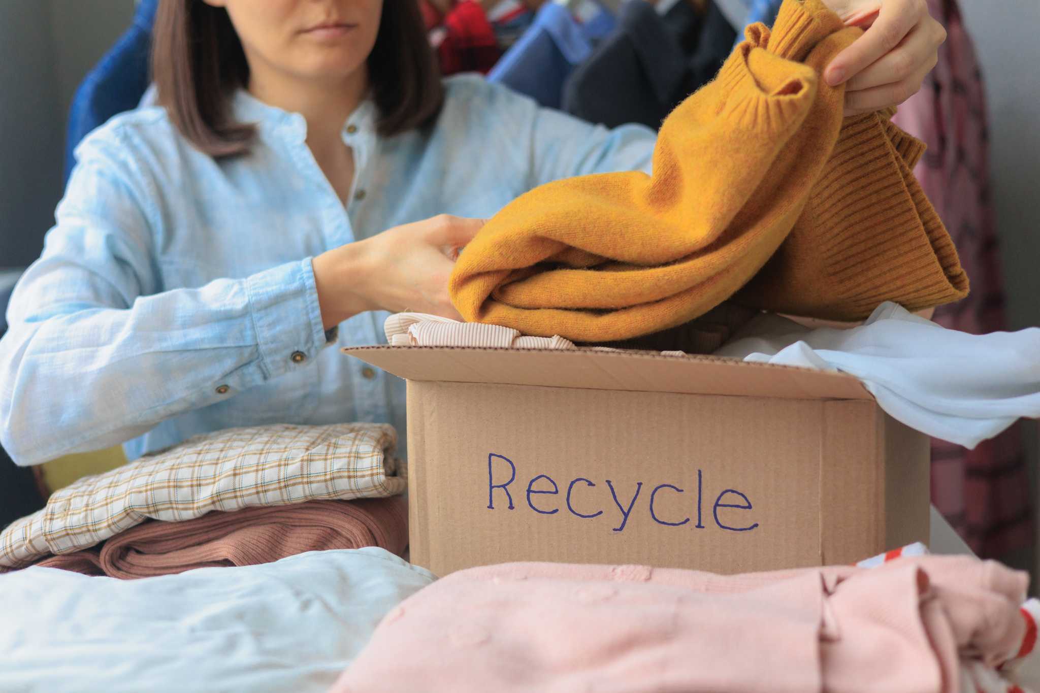 Lady recycling her clothing.